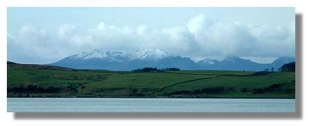 Snow-covered Arran Hills rising behind Great Cumbrae